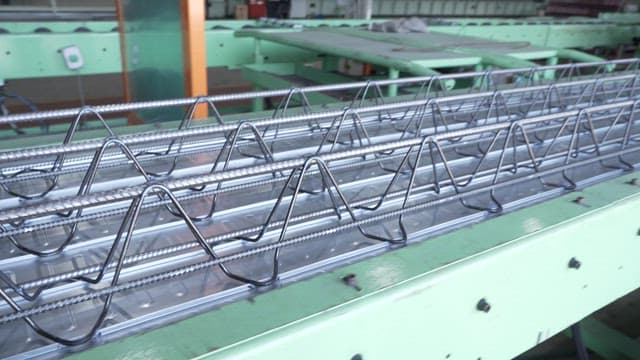 Workers operating machinery in a factory