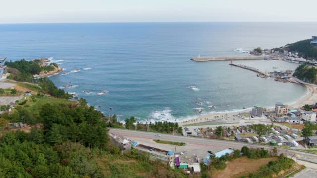 Coastal view with a lighthouse and harbor