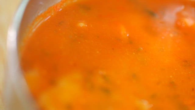 Thick, red broth of spicy hand-pulled dough soup 