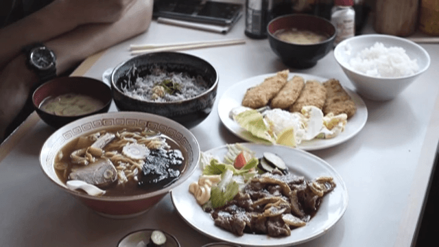 Table Set with Various Traditional Japanese Dishes at a Restaurant