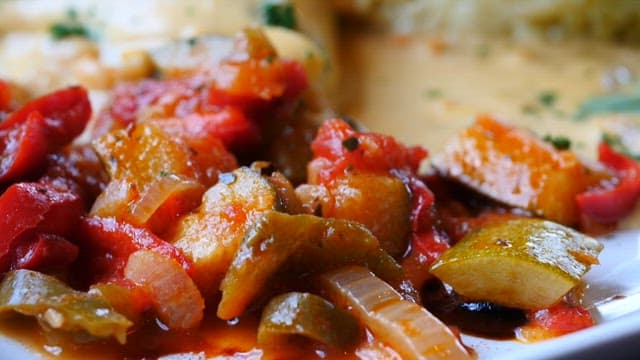 Delicious gourmet meal on a plate with cream sauce