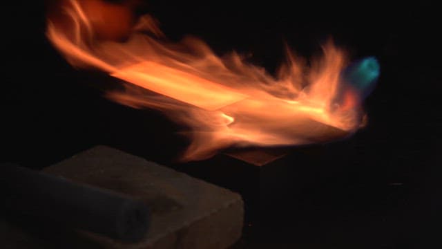 Metal being heated with intense flames