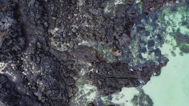Rocky shoreline with clear blue water