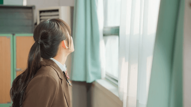 Student looking out the window