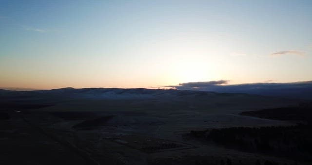 Sunrise over a vast mountain landscape