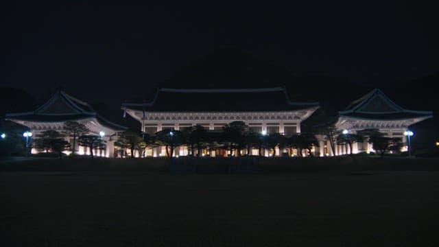 Illuminated Blue House at night