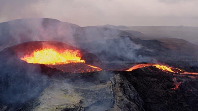 Flowing Lava from a Volcanic Eruption in the Mountains