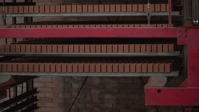 Bricks stacked on shelves in a factory