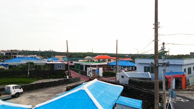 Village with small agricultural fields with colorful roofs