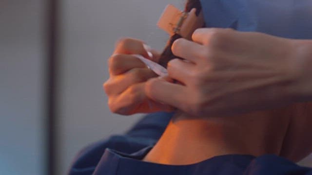 Doctor Wearing Scrubs for Sterilization in Operating Room