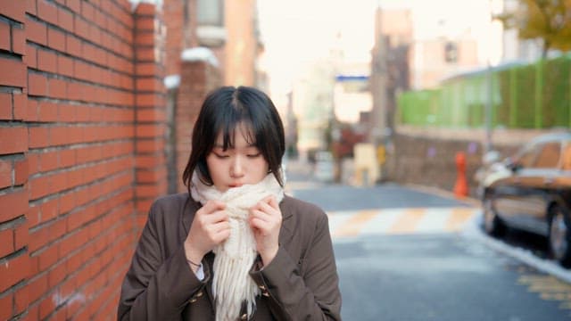 Student walking on the street in winter
