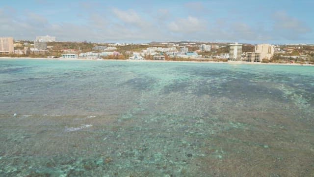 Coastal city with clear blue ocean