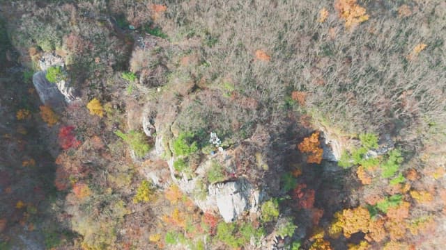 Colorful autumn mountains with rocky cliffs