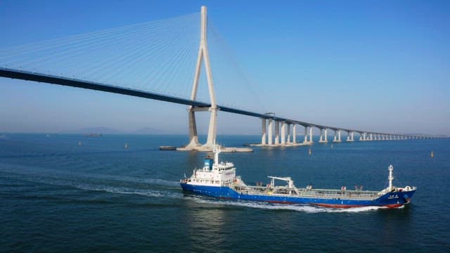 Large ship passing under a Incheon bridge
