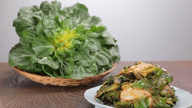 Fresh spring cabbage and fresh kimchi on a table