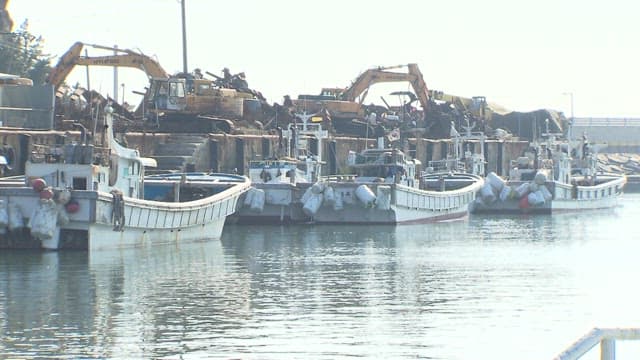 Docked fishing boats at a coastal harbor