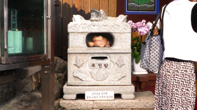 Traditional Korean wishing stone with a frog