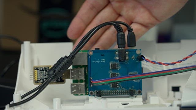 Hands assembling and wiring an wireless internet connection device