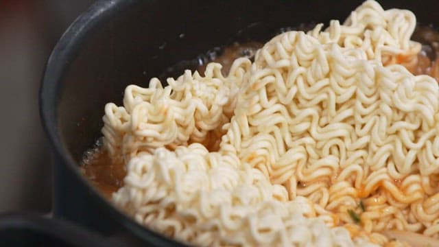 Red Ramen Boiling in a Pot