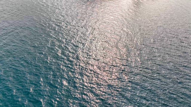 Coastal town with a lighthouse on a hill