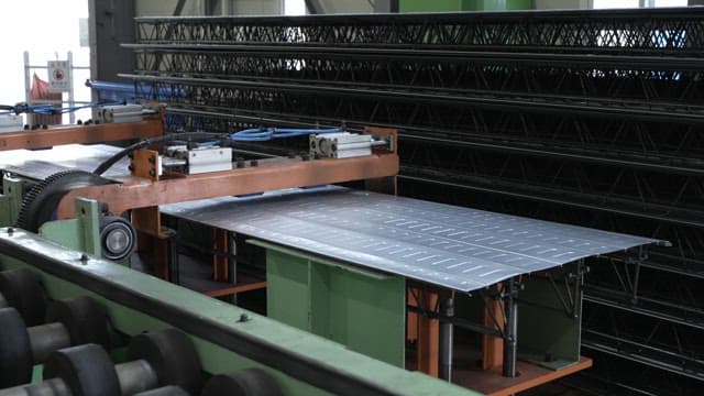 Metal sheets being processed in a factory