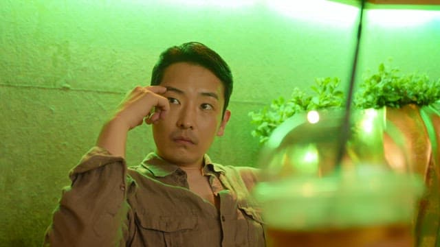 Man relaxing with a drink in a cafe