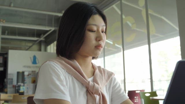 Woman working on a tablet indoors