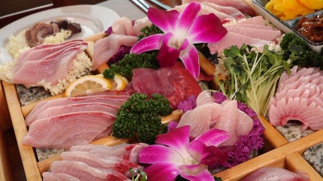 Variety of fresh sashimi and side dishes