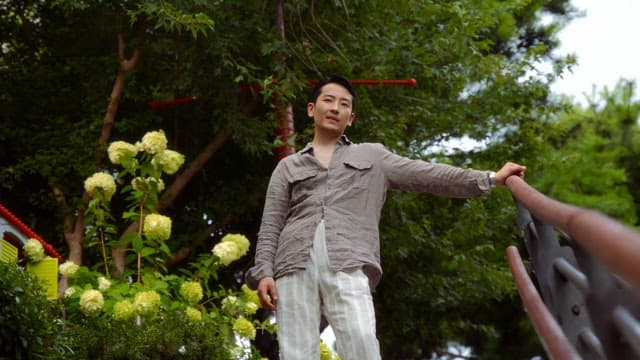 Man coming down garden stairs