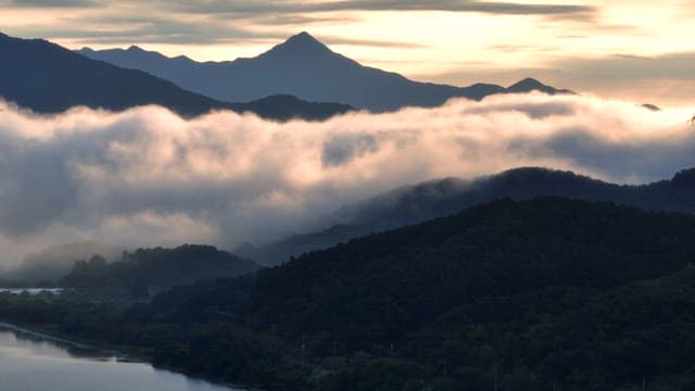 Mountains with clouds at sunrise