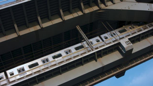 Subway Passing under a Bridge