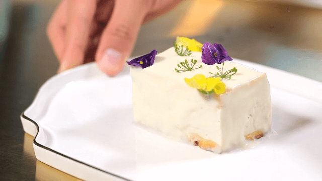 Tofu dish decorated with edible flowers