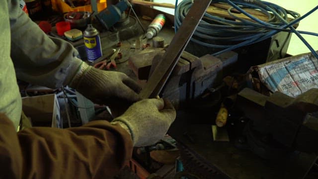 Person working with tools in a factory