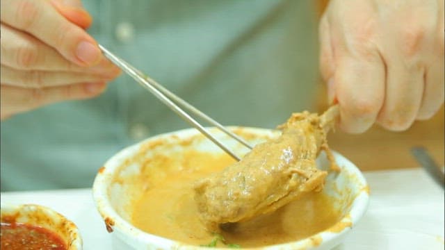 Duck meat dipped in spicy sauce