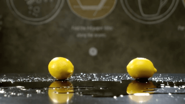 Lemons rolling over a shiny surface