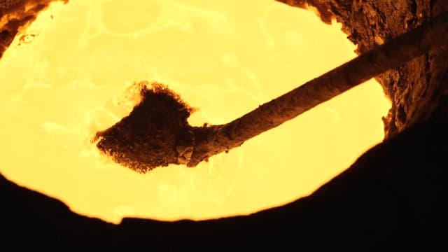 Molten metal being stirred in a furnace