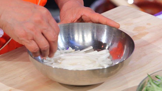Preparing ingredients for a cold raw fish soup