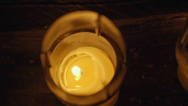 Close-Up of a Candle Flame in Darkness