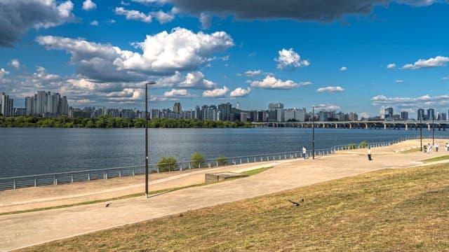 Riverfront park with city skyline