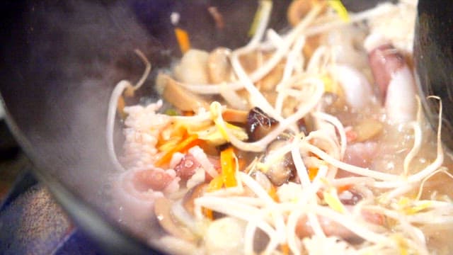 Cooking Chinese Food with Fresh Vegetables and Seafood