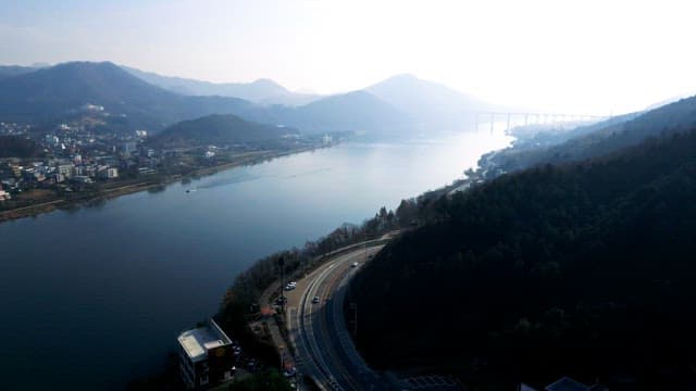 River by Mountainous Town