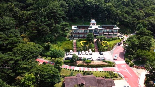 View of a building in a forest during the day