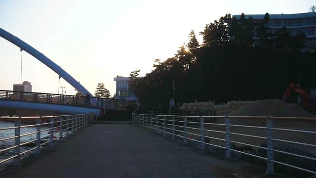 Serene Coastal Cityscape with Bridge at Dusk