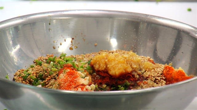 Mixing spices and ingredients in a bowl