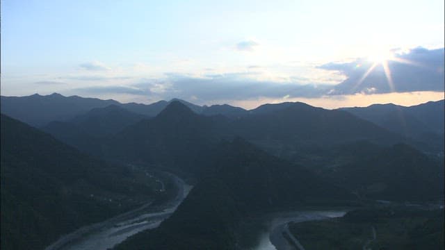 Aerial View of Serene Donggang River Meandering Through Lush Landscape