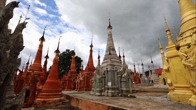 Serene Buddhist Temple Featuring Statues and Pagodas