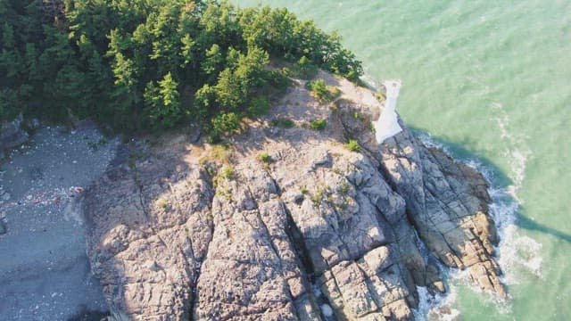 Lighthouse on a rocky coastal cliff