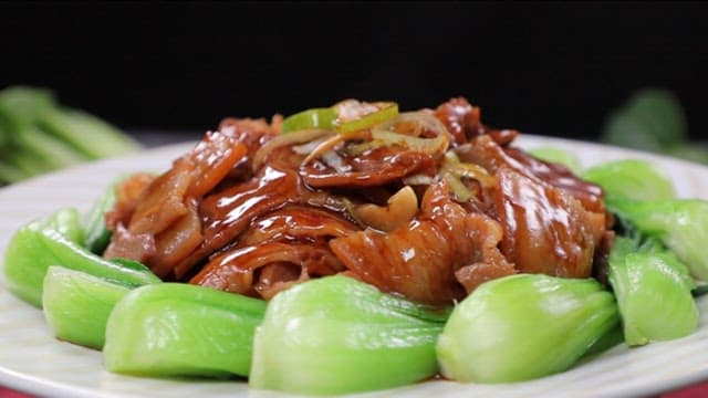 Plate of spice pork with bok choy