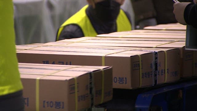 Workers Handling Boxes at a Distribution Center
