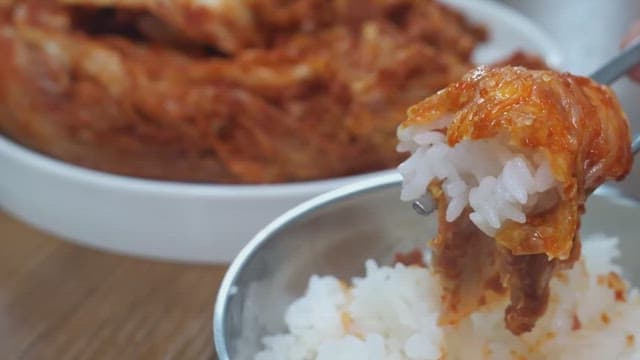 Steaming rice served with kimchi